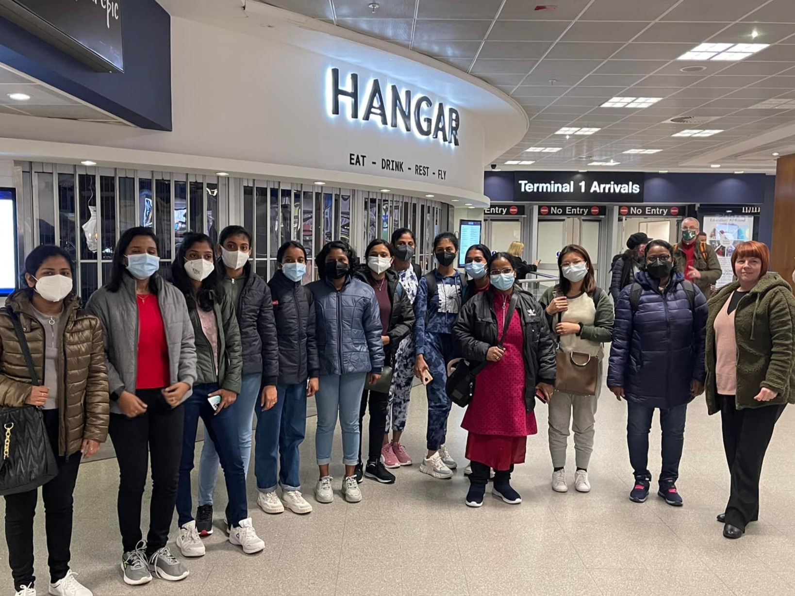 A group of international nursing candidates arriving at the airport